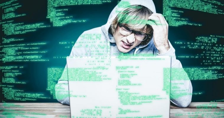 composite image of man in hood jacket hacking a laptop