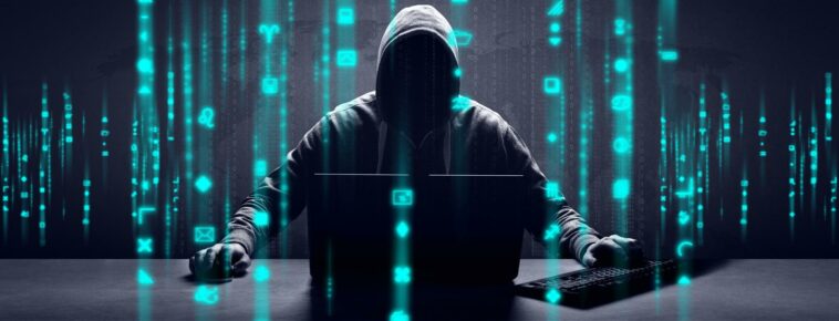 anonymous internet hacker in front of computer web crime concept